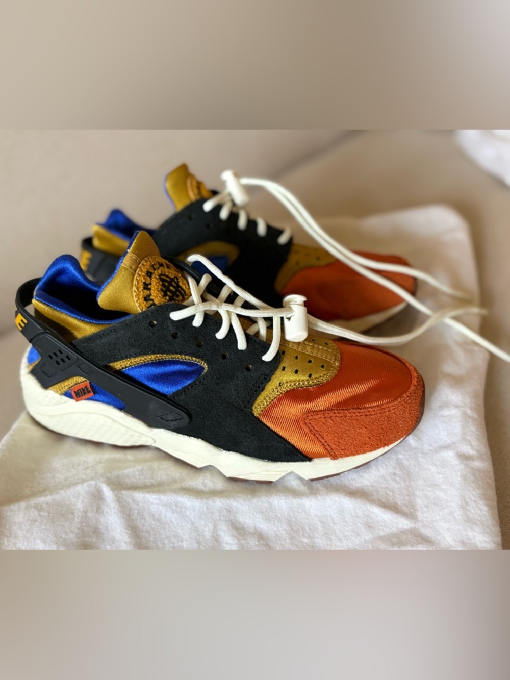 Nike Air Huarache Sneakers Goldtone/Black/Coconut Milk Tan